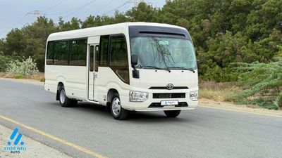 2025 Toyota Coaster, bílá, 0 km, dovoz SAE — foto 4 z 24