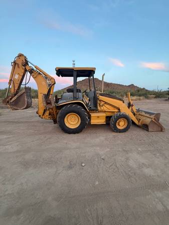 Caterpillar BACKHOE, zlatá, dovoz USA — foto 9 z 12