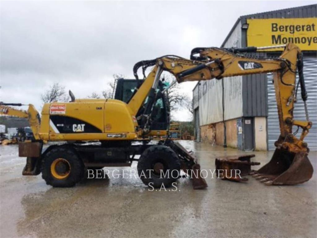 2012 Cat M313D, 7 326 mth, dovoz Skladem v EU — foto 1